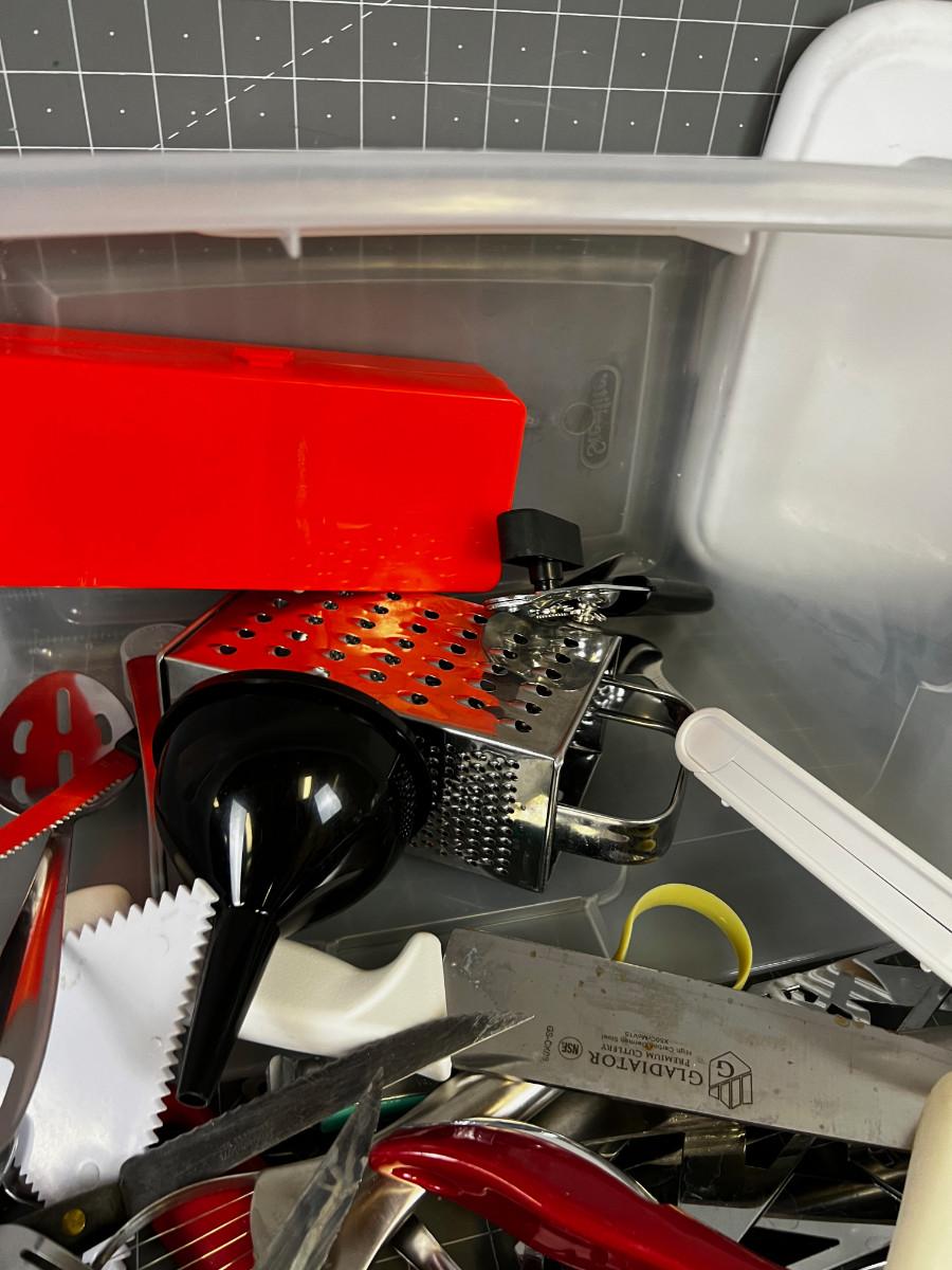 Tub full of Kitchen Utensils