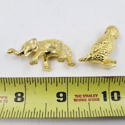 SMALL GOLD TONED METAL MINATURE FIGURINES