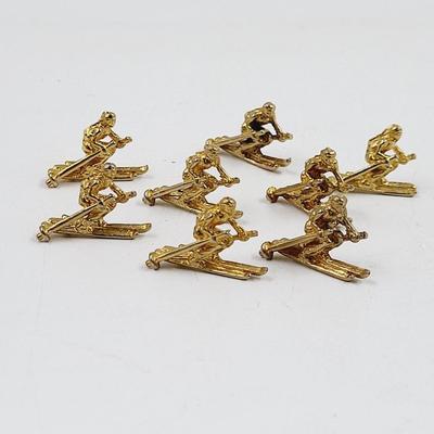 SMALL GOLD TONED SKI MINATURES