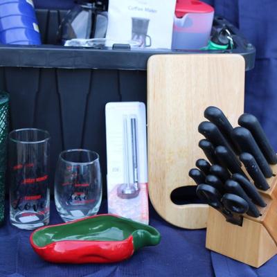 Assorted kitchenware; cutlery, plastic cups, coffee maker, plastic pitcher, meat thermometer, chopping board, black handle knife set and...