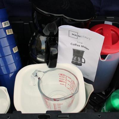 Assorted kitchenware; cutlery, plastic cups, coffee maker, plastic pitcher, meat thermometer, chopping board, black handle knife set and...