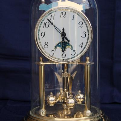 Glass encased clock. Plastic. Made in Japan. And Small Crystal Melody Quartz Hygrometer and clock