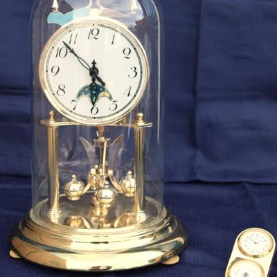 Glass encased clock. Plastic. Made in Japan. And Small Crystal Melody Quartz Hygrometer and clock