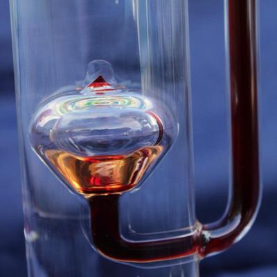 Set of 2 Galileo thermometers (20" and 14"); multi-colored spheres. Some water evaporation.