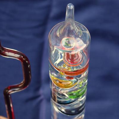 Set of 2 Galileo thermometers (20" and 14"); multi-colored spheres. Some water evaporation.