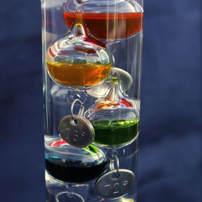 Set of 2 Galileo thermometers (20" and 14"); multi-colored spheres. Some water evaporation.