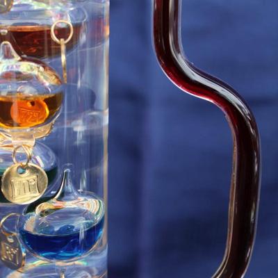 Set of 2 Galileo thermometers (20" and 14"); multi-colored spheres. Some water evaporation.