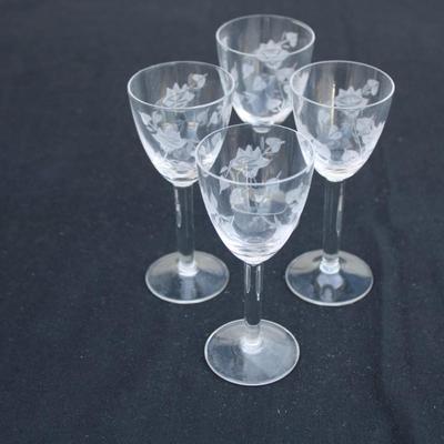 Set of 4 crystal engraved sherry glasses.