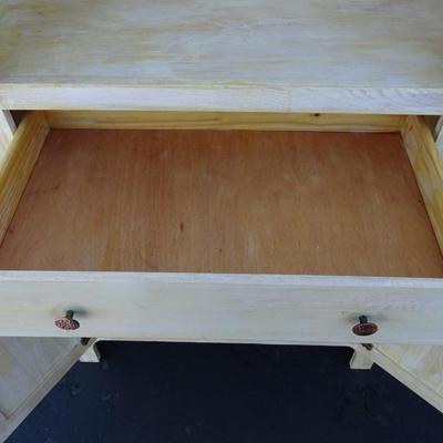 One drawer hutch, open bottom shelf and two enclosed shelves with glass doors.