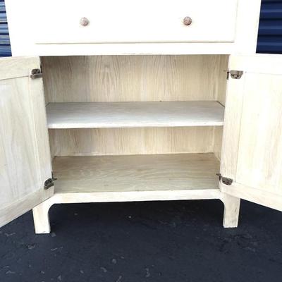 One drawer hutch, open bottom shelf and two enclosed shelves with glass doors.