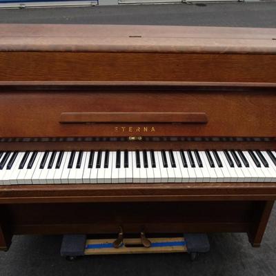 Eterna upright piano; minor wear and tear
