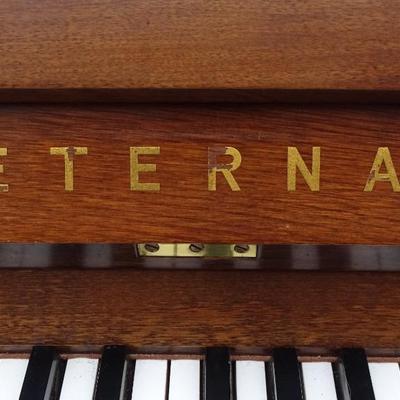 Eterna upright piano; minor wear and tear