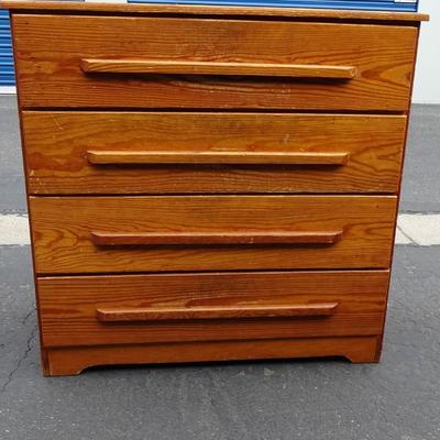 Wooden chest of drawers. Wear and tear over all.