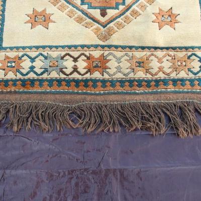 Rust ivory, rust and turquoise Turkish wool rug; machine made