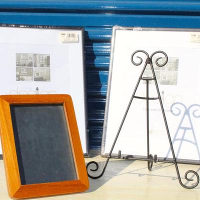 3 picture frames; 2 new, one used, and one easel style picture stand