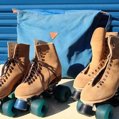 Two sets of roller skates (one size Womens 6, one size Mens 9), large roller skate bags with 2 sets of elbow pads and 2 sets of knee pads