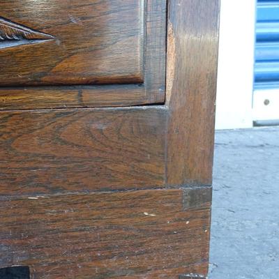 Oriental chest of drawers; carvings on drawer fronts and sides of dresser