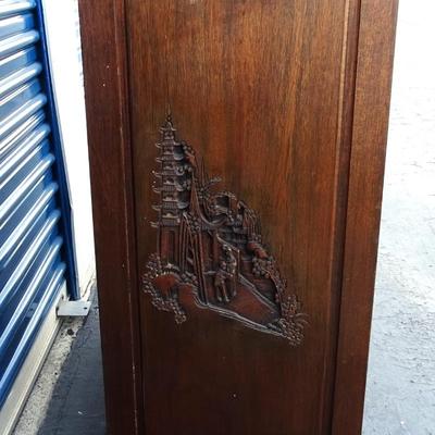 Oriental chest of drawers; carvings on drawer fronts and sides of dresser