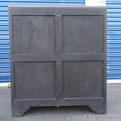 Oriental chest of drawers; carvings on drawer fronts and sides of dresser