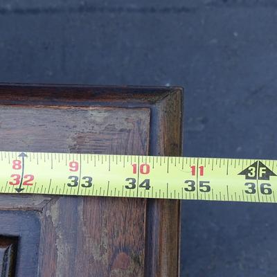 Oriental chest of drawers; carvings on drawer fronts and sides of dresser