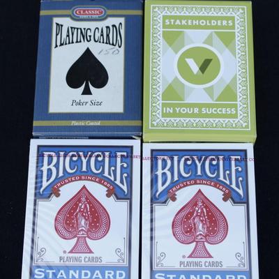 Wilson baseball mitt and four decks of playing cards