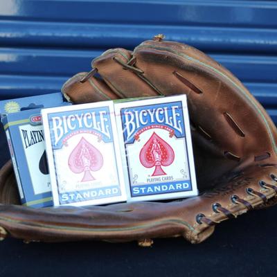 Wilson baseball mitt and four decks of playing cards