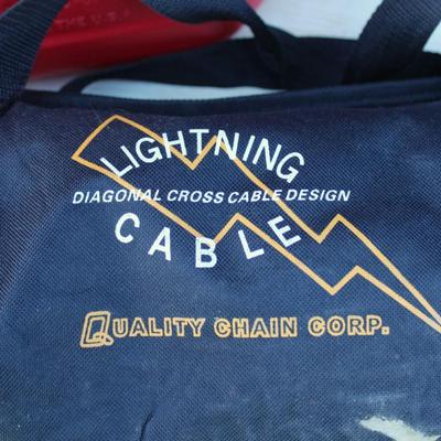Blitz 5 gallon gasoline jug and Quality Chain Corp lightning cable snow chains