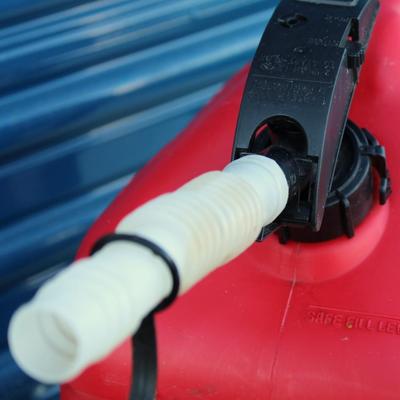 Blitz 5 gallon gasoline jug and Quality Chain Corp lightning cable snow chains