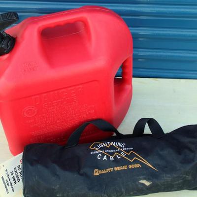 Blitz 5 gallon gasoline jug and Quality Chain Corp lightning cable snow chains