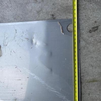 Two pieces of sheet metal, stainless steel & aluminum
