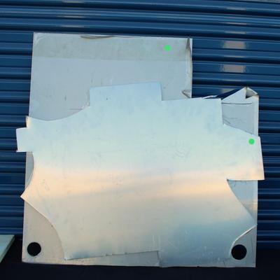 Two pieces of sheet metal, stainless steel & aluminum