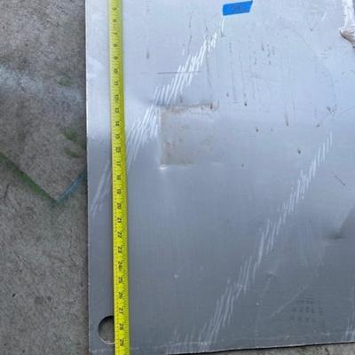 Two pieces of sheet metal, stainless steel & aluminum