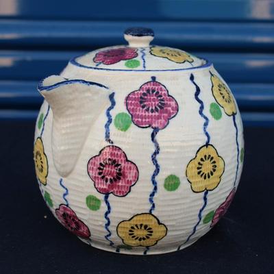 Revelation (Japan) teapot, rolled newspaper basket and decor including four oversized paper clips, ceramic pen holder and a handcrafted...