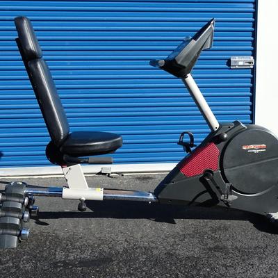 Exercise bike with built in small weights rack.