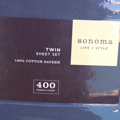 New household items:  Sonoma twin XL sheet set, BackRelax portable footstool and PacVac sacks.