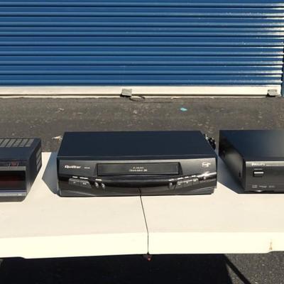 RCA VHS player, Quasar VHQ-940 VHS Player, and a Philips DVD Player