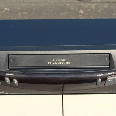 RCA VHS player, Quasar VHQ-940 VHS Player, and a Philips DVD Player