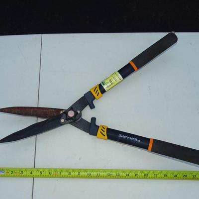 Assorted gardening tools and work gloves.