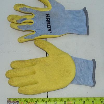 Assorted gardening tools and work gloves.