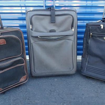 Assortment of luggage including Ventura, Travelpro and Ettenne Aigner