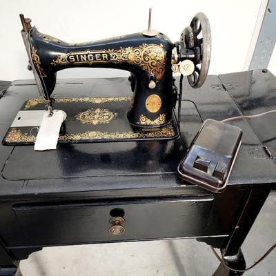 Beautiful gold gilt early electric Singer sewing machine in cabinet