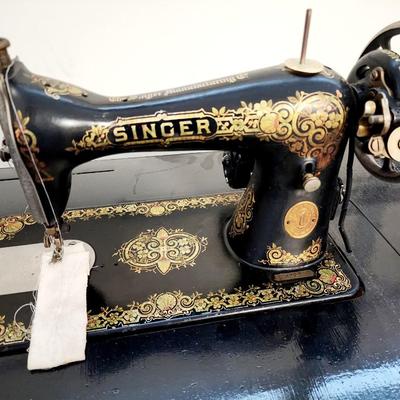 Beautiful gold gilt early electric Singer sewing machine in cabinet