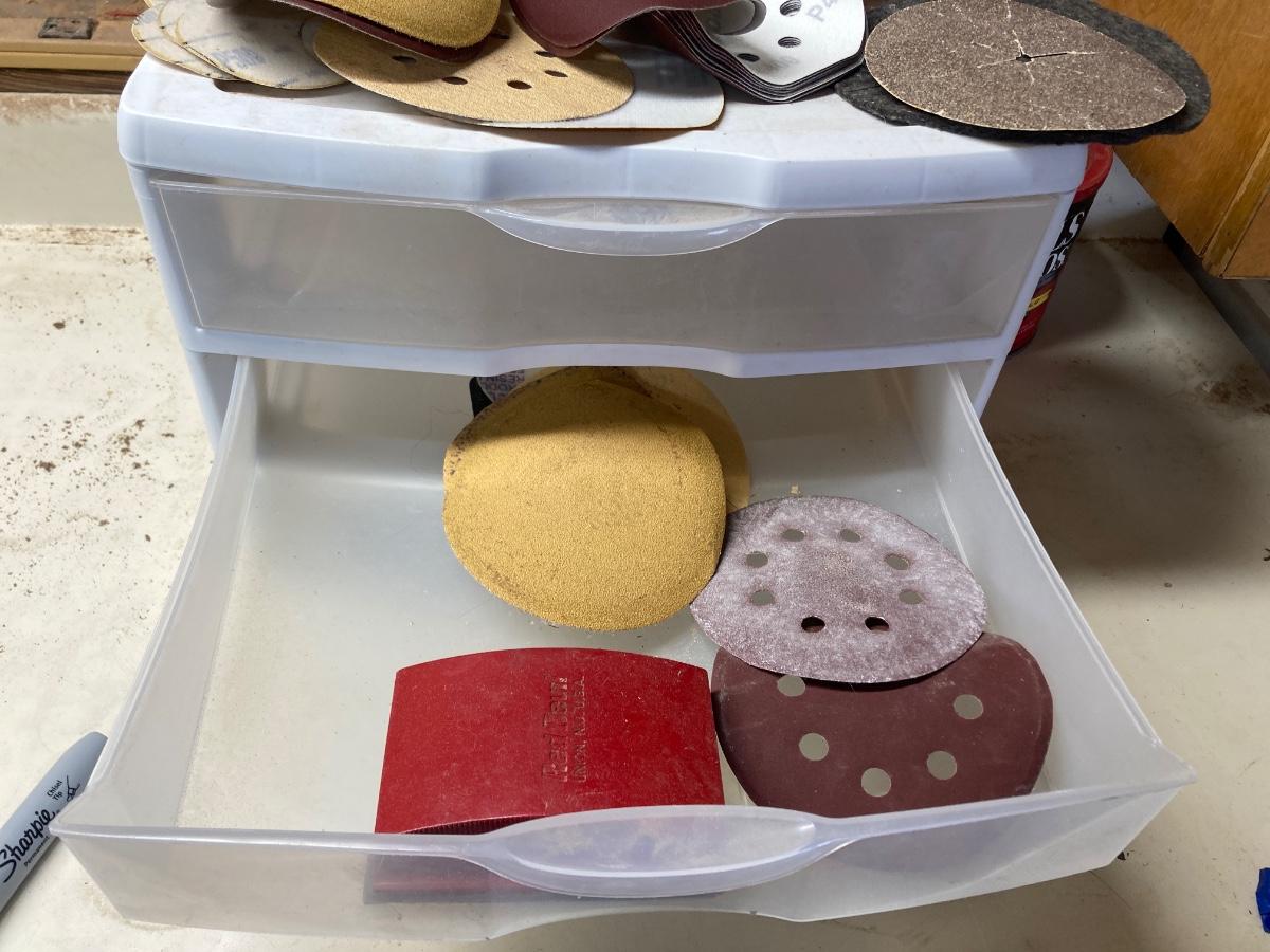 SANDPAPER, STORAGE CONTAINER, AND SCRUB BRUSH