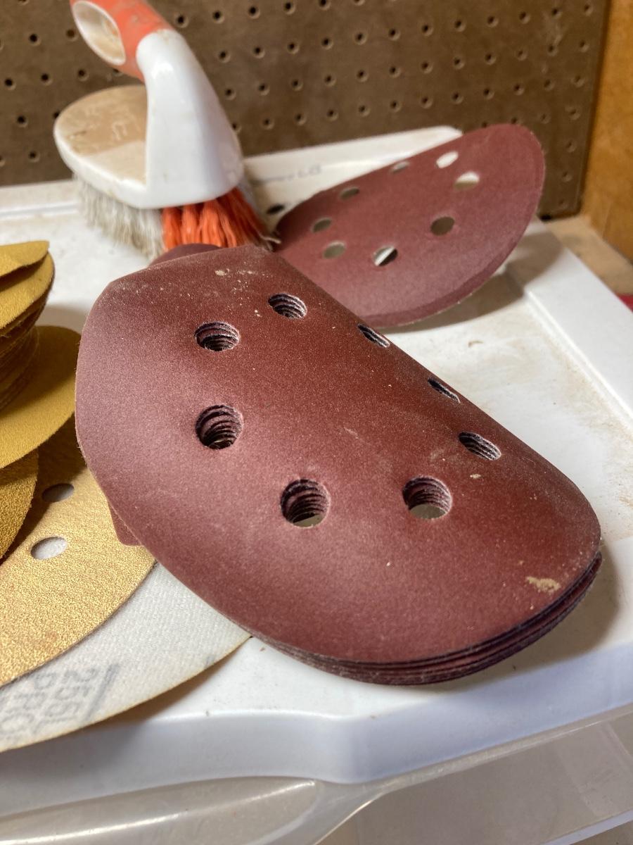 SANDPAPER, STORAGE CONTAINER, AND SCRUB BRUSH