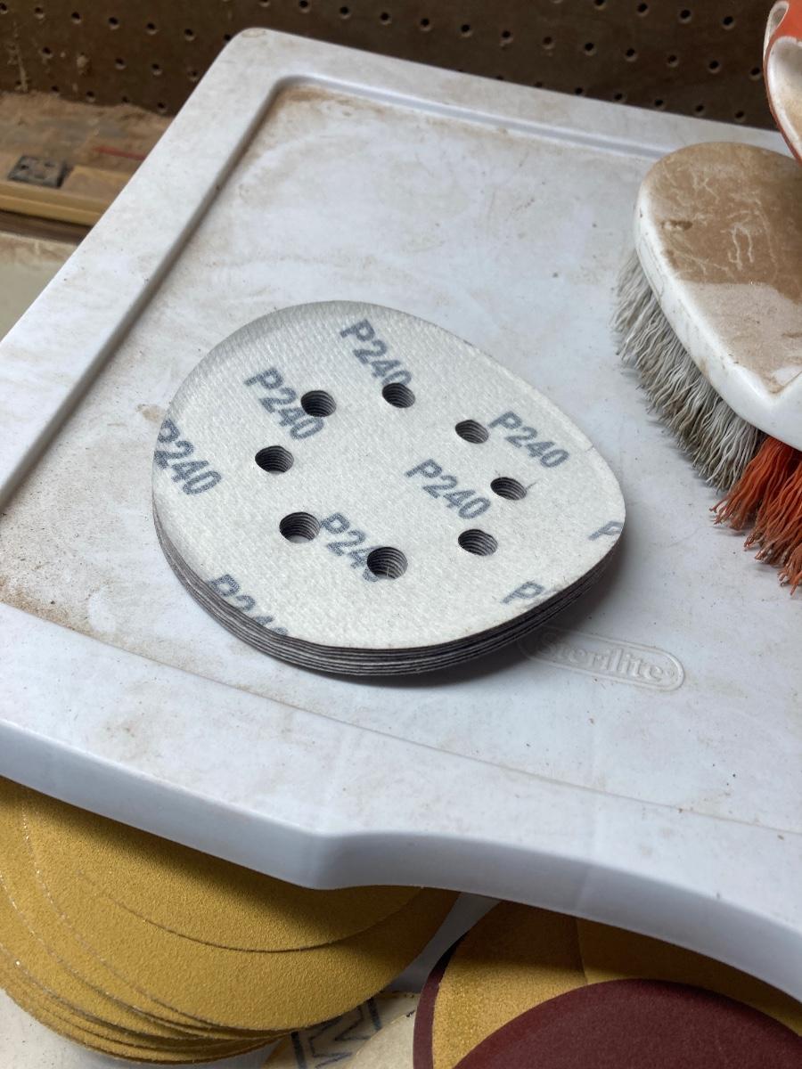 SANDPAPER, STORAGE CONTAINER, AND SCRUB BRUSH