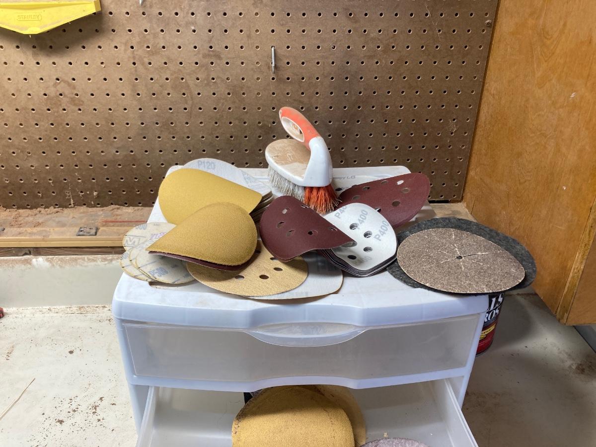 SANDPAPER, STORAGE CONTAINER, AND SCRUB BRUSH