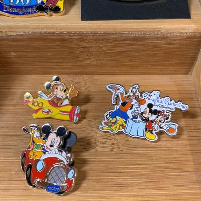 LOT 115R: Disney Collectibles: Unique Pins, Buttons, and Coke Bottles