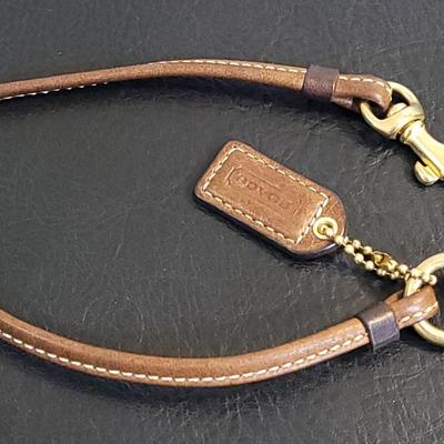 Lot 1: Brown Leather COACH Wristlet