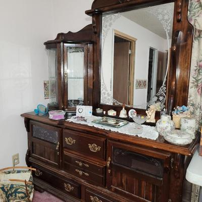 Vintage dresser with lighted curio and more