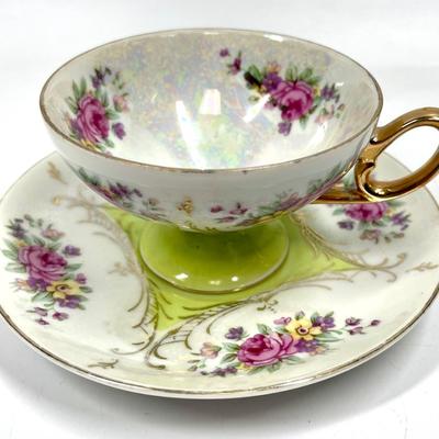 Flower patterned and lime green tea cup and saucer